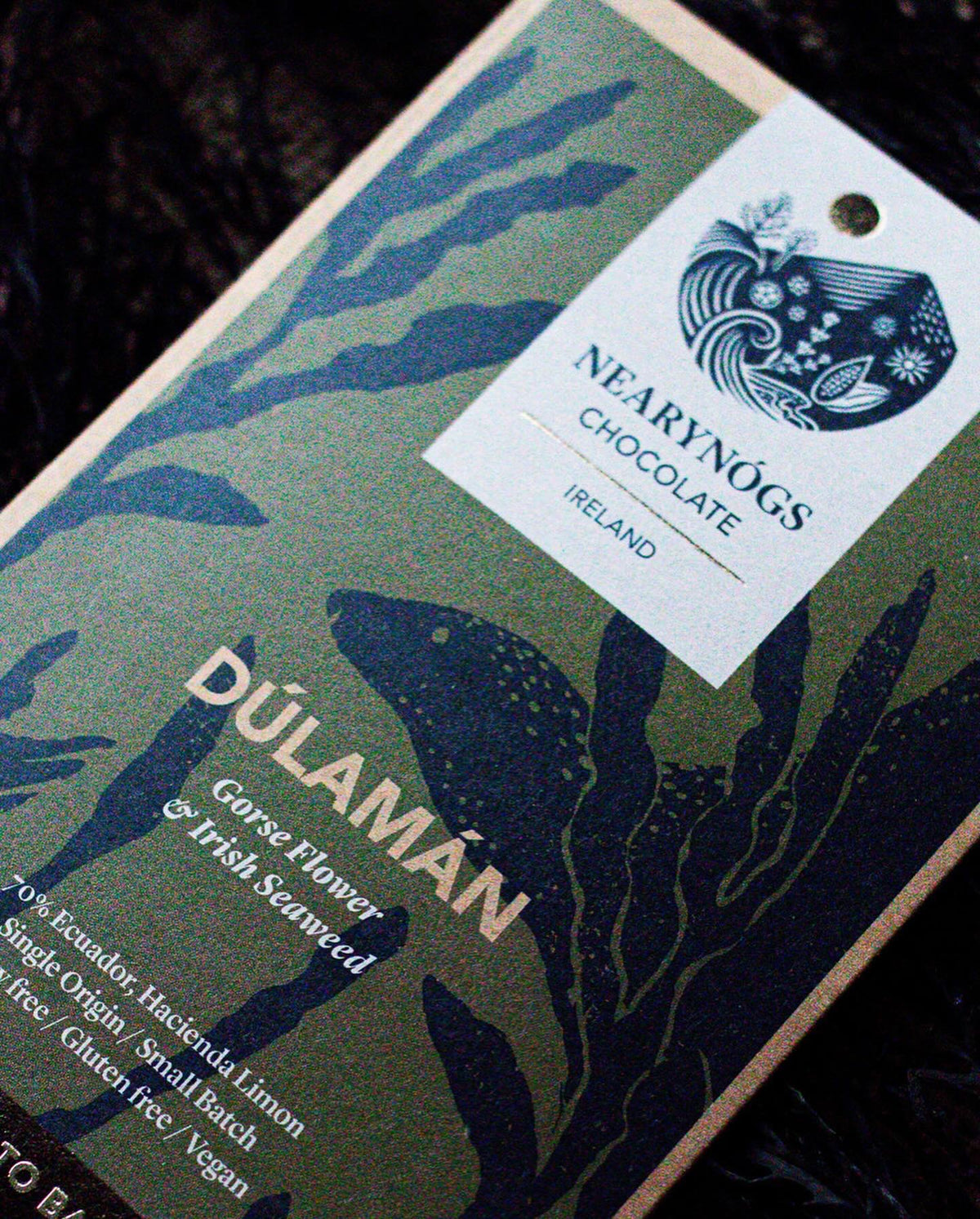 Close up image of NearyNógs Gorse Flower & Irish Seaweed chocolate bar with seaweed design and branding. 